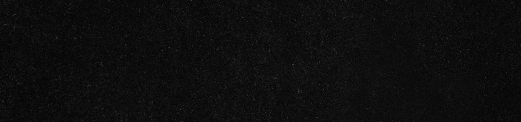 A solid black background with a subtle texture.