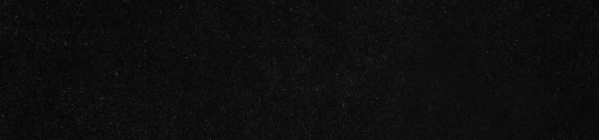A solid black background with a subtle texture.