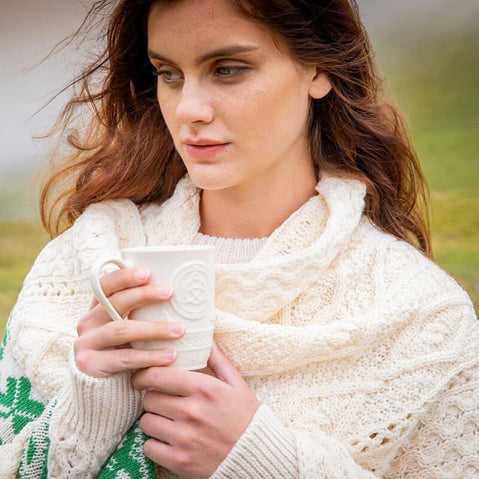 Irish woman holding a Belleek celtic mug