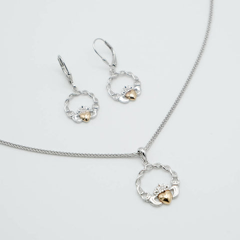Jewelry set with necklace and earrings on a light gray background