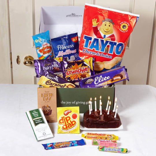 Irish birthday gift box with Tayto crisps, chocolate bars, sweets and birthday cake with candles