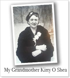 Black-and-white portrait of a woman in a black fur coat with a flower pinned to her lapel. She stands smiling with her arms crossed. The image includes the text