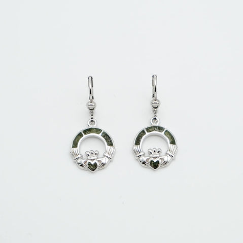 Pair of silver Claddagh earrings on a light gray background