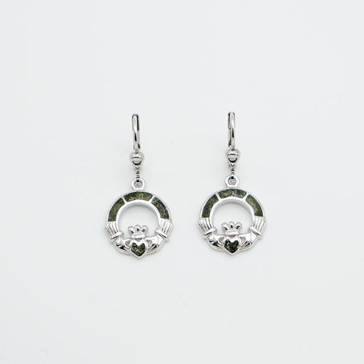 Pair of silver Claddagh earrings on a light gray background