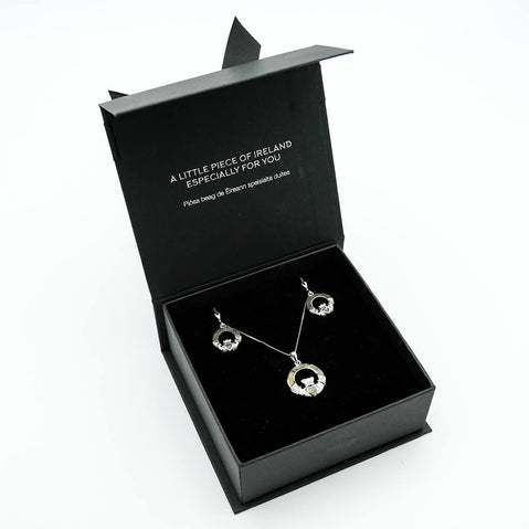 Jewelry set in a black box with text on a white background