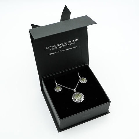 Jewelry set in a black box with text on a white background