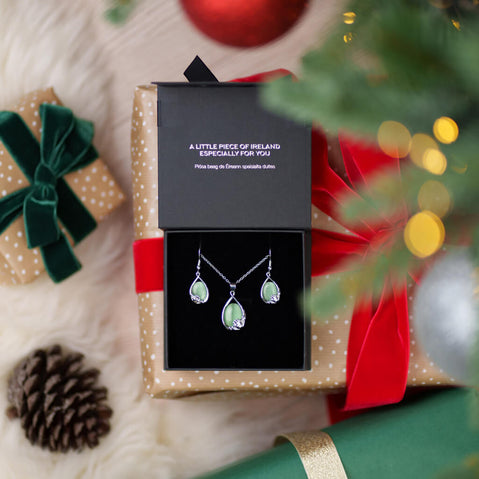 Celtic Cats Eye Claddagh Jewelry Set in a gift box with Christmas decorations in the background