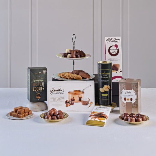 Taste of Ireland Sweet Treats Gift Box featuring Butlers Irish Atlantic Sea Salt Caramels, Lily O'Brien's Crispy Hearts chocolates, Irish oat cookies, lemon shorties, milk chocolate, and assorted Irish confectionery.
