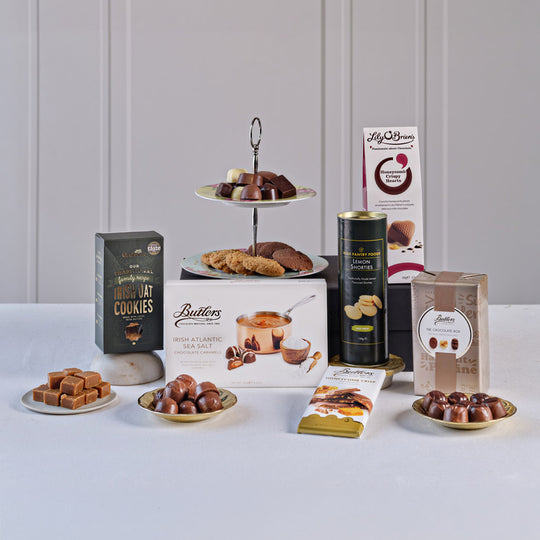 Taste of Ireland Sweet Treats Gift Box featuring Butlers Irish Atlantic Sea Salt Caramels, Lily O'Brien's Crispy Hearts chocolates, Irish oat cookies, lemon shorties, milk chocolate, and assorted Irish confectionery.