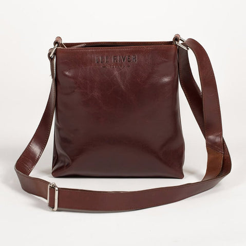 Brown leather crossbody bag with adjustable strap, featuring a clean minimalist design and embossed “LEE RIVER” branding on the front.