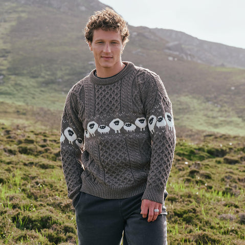Image featuring the Traditional Sheep Aran Sweater in brown, crafted with authentic Irish Aran knit patterns and iconic sheep motifs, combining heritage-inspired Irish knitwear with timeless countryside style.