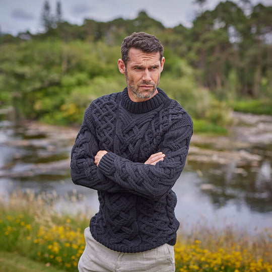 Black Mens Trellis Aran Sweater worn by an Irish man