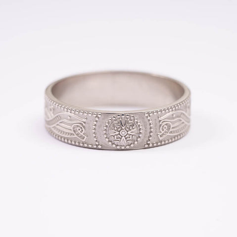 A sterling silver wedding band with intricate Celtic design, displayed against a white background.