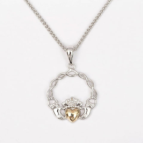A Claddagh pendant featuring a gold heart and silver plating, displayed on a white background.