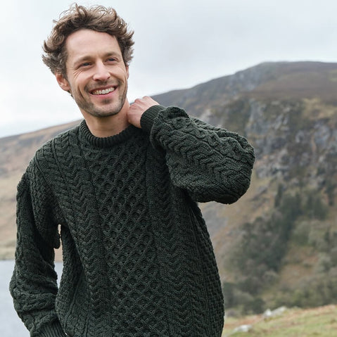 Men's traditional army green crew neck Aran sweater, knitted with authentic Irish wool and classic cable patterns.