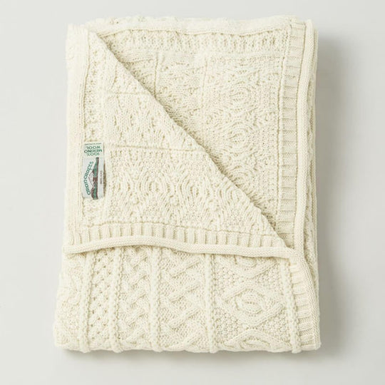 Irish Home Decor - Celtic Two Tone Cream Aran Throw Blanket folded neatly on a plain white background.