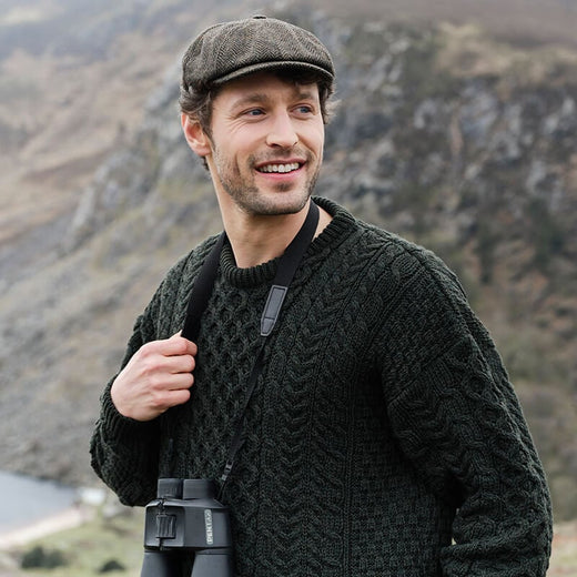 Men's classic Irish tweed driving cap in a deep green, crafted from authentic Donegal tweed