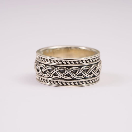 A sterling silver ring featuring detailed Celtic knot work.