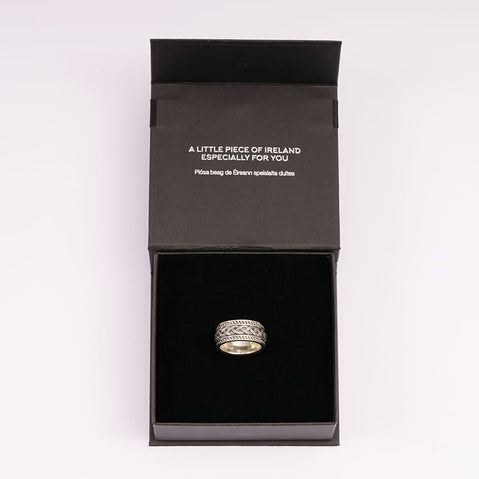 Sterling silver gents Celtic knot band with oxidized detailing on The Irish Store black jewelry box.