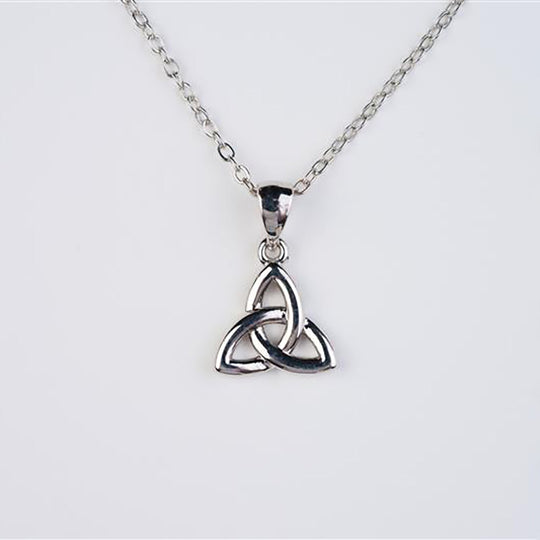 Silver Trinity knot pendant on a chain against a white background