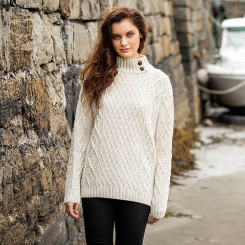 Women's cream Aran fisherman sweater with diamond stitch pattern and button-mock neck, handcrafted in Ireland from merino wool