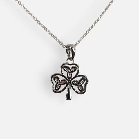 Silver shamrock pendant necklace on a white background