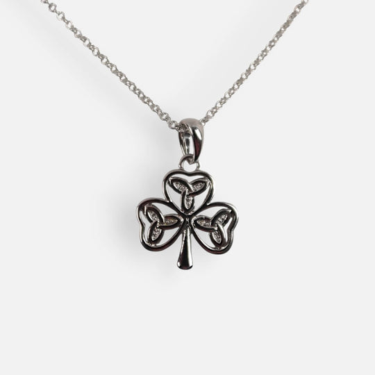 Silver shamrock pendant necklace on a white background