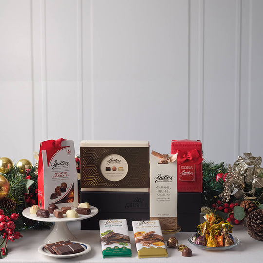 Butlers chocolate products displayed on a table with festive decorations.