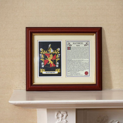 Framed personalized family crest display featuring a colorful coat of arms and an accompanying printed history, set in a dark wood frame on a mantel.