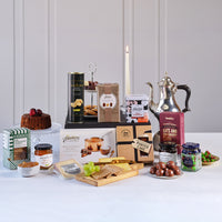 Irish Gourmet Delights Gift Basket featuring Bewley’s Irish Afternoon Tea, Butlers Sea Salt Caramels, traditional Irish fruit cake, Irish oat and cranberry cookies, Sheridan’s crackers, Ballymaloe relish, Irish cheese, chocolates, and sweet treats.