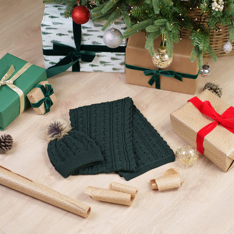 Green Aran cable knit hat and scarf set with traditional Irish patterns, perfect for winter warmth and festive holiday gifting