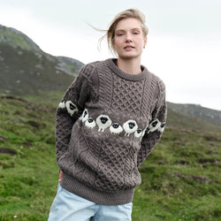 Image featuring the Traditional Sheep Aran Sweater in brown, crafted with authentic Irish Aran knit patterns and iconic sheep motifs, combining heritage-inspired Irish knitwear with timeless countryside style and traditional craftsmanship.