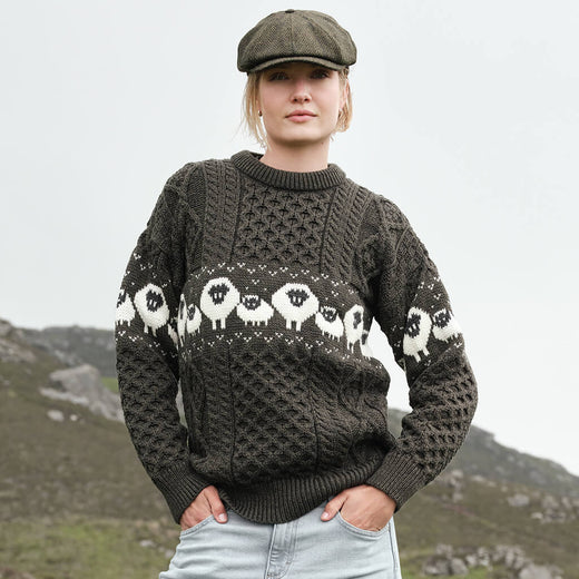 Image featuring the Traditional Sheep Aran Sweater in brown, crafted with authentic Irish Aran knit patterns and iconic sheep motifs, combining heritage-inspired Irish knitwear with timeless countryside style and traditional craftsmanship.