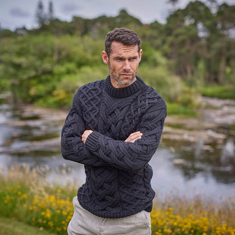 Black Mens Trellis Aran Sweater worn by an Irish man 