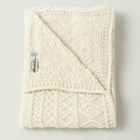 Irish Home Decor - Celtic Two Tone Cream Aran Throw Blanket folded neatly on a plain white background. 