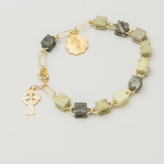 A Connemara Marble Rosary Bracelet with gold-tone medals of The Saint Patrick and a Celtic Cross crucifix.
