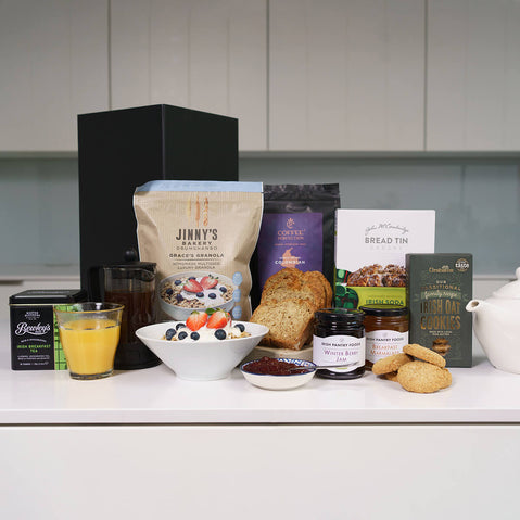 Irish breakfast gift box with granola, soda bread, tea, marmalade and oat cookies on kitchen counter