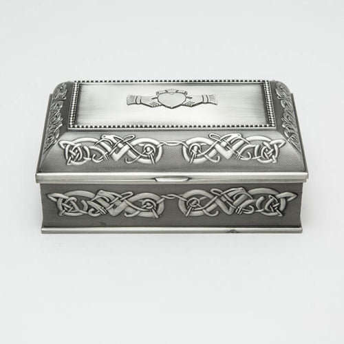 A large rectangular Mullingar Pewter jewelry box with Celtic knot designs and a claddagh ring motif on the lid.