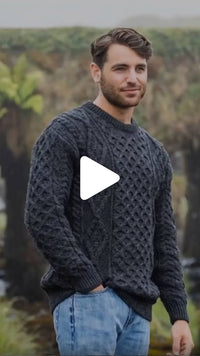 Video featuring the Men's Heritage Crew Neck Aran Sweater in charcoal, crafted with authentic Irish Aran cable knit patterns and a timeless crew neck design, inspired by Ireland's rich knitting heritage.
