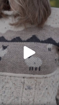 Video from The Irish Store featuring the Women’s Sheep Aran Sweater, highlighting the knit sheep pattern in a rural Ireland setting.
