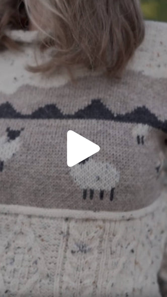 Video from The Irish Store featuring the Women’s Sheep Aran Sweater, highlighting the knit sheep pattern in a rural Ireland setting.