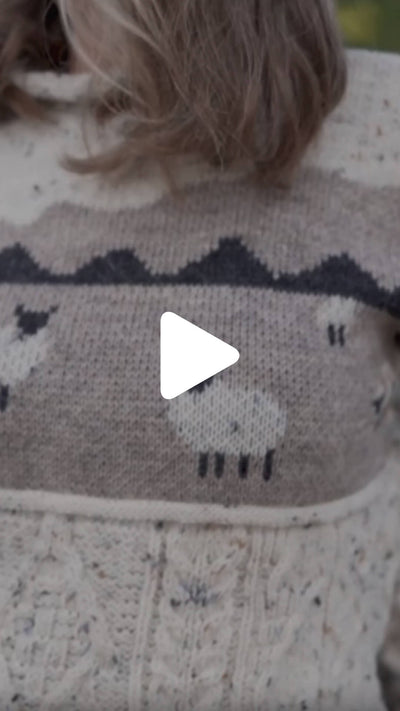 Video from The Irish Store featuring the Women’s Sheep Aran Sweater, highlighting the knit sheep pattern in a rural Ireland setting.