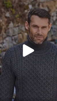 Video featuring the Men's Signature Fisherman Turtleneck Wool Sweater in charcoal, crafted from premium wool with authentic Irish fisherman cable knit patterns and a warm ribbed turtleneck, inspired by Ireland's rich knitting heritage.