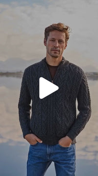 Video featuring the Mens Fisherman Full Zip Cardigan in navy, crafted with authentic Irish fisherman cable knit patterns and a full-zip closure, combining classic Aran style with everyday comfort.
