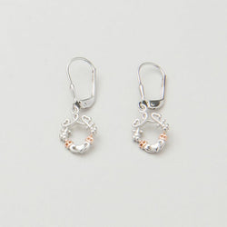 A pair of silver earrings featuring a looped heart design with a lucky shamrock and the iconic Irish Claddagh symbol, accented with a hint of rose gold.