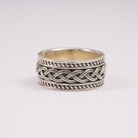 A sterling silver ring featuring detailed Celtic knot work.