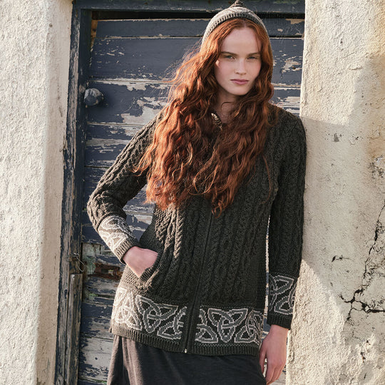 Image featuring the Women's Celtic Knot Hooded Aran Sweater Cardigan in army green, crafted with authentic Irish Aran cable knit patterns, Celtic knot accents, a practical hood, and full-zip closure, showcasing timeless Irish craftsmanship.