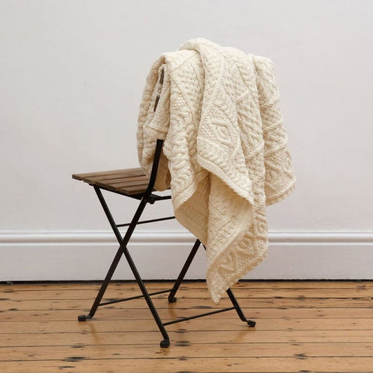 Irish Home Decor - Celtic Two Tone Aran Throw Blanket hanged on a chair