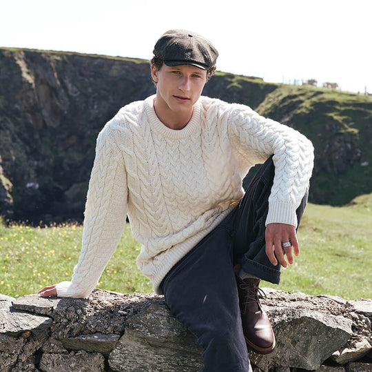 Image featuring the Men's Cable Knit Crew Neck Wool Sweater in natural cream, crafted from premium wool with authentic Irish cable knit patterns and a timeless crew neck silhouette, inspired by Ireland's rich knitting heritage.