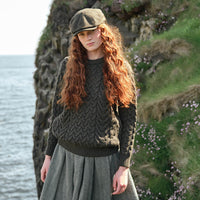 Image featuring the Women's Cable Knit Crew Neck Sweater in army green, crafted with authentic Irish cable knit patterns and a timeless crew neck silhouette, inspired by Ireland's rich knitting heritage and traditional craftsmanship.